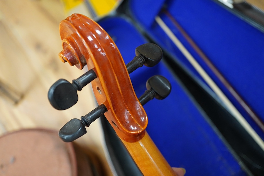 A quantity of violin parts and violins, a ukelele, a double bass scroll, a pinfold metronome, a violin case by Hill, a viola etc. Condition - for restoration